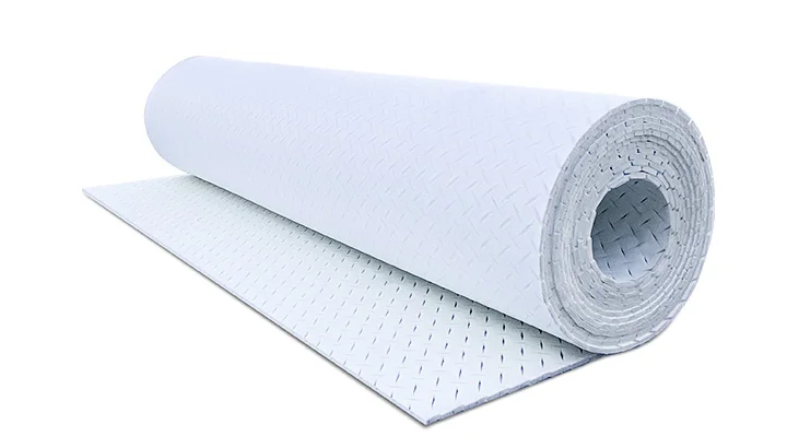 Couche de souplesse pour installation de fausse pelouse